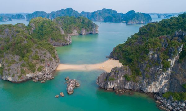 Beach connecting islands in Bai Tu Long Bay.