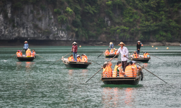 Frog Lagoon guests on bamboo boats.
