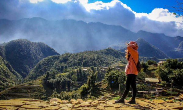 Sapa guest in front of Cat Cat Village.