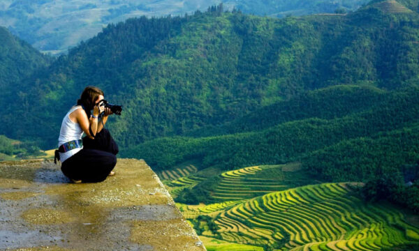 Sapa guest taking photos of Sin Chai Village.