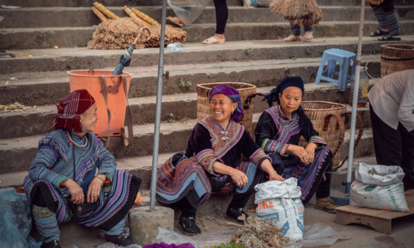 Smiling vendors in Bac Ha Market.