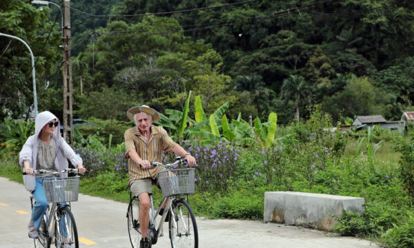 Viet Hai guests cycling on the road.