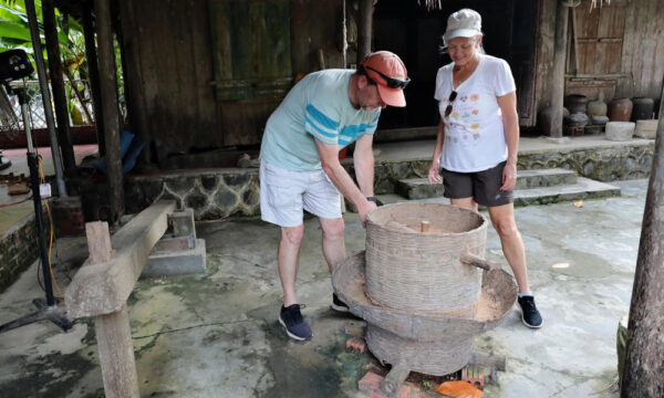 Visitors to Viet Hai Village old houses.