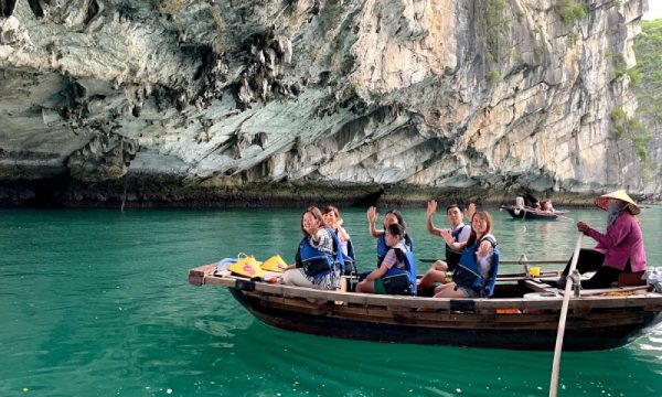 Vung Vieng guests on a bamboo boat.
