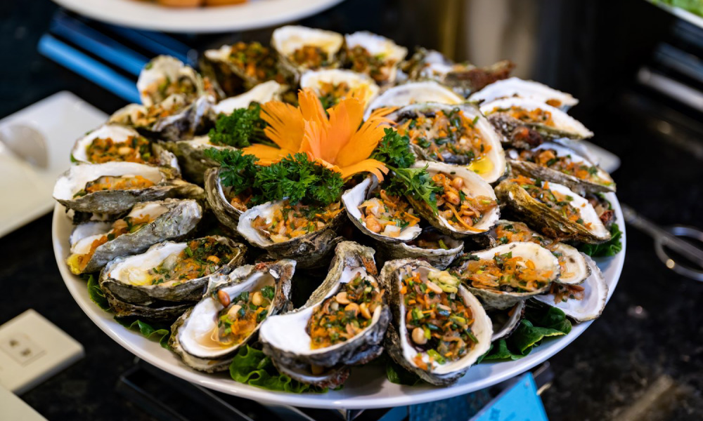 A plate of grilled oysters.