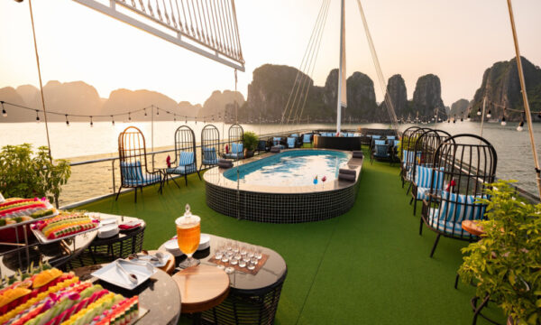 The deck of Sunlight Grand day cruise looking out to Halong Bay islands.