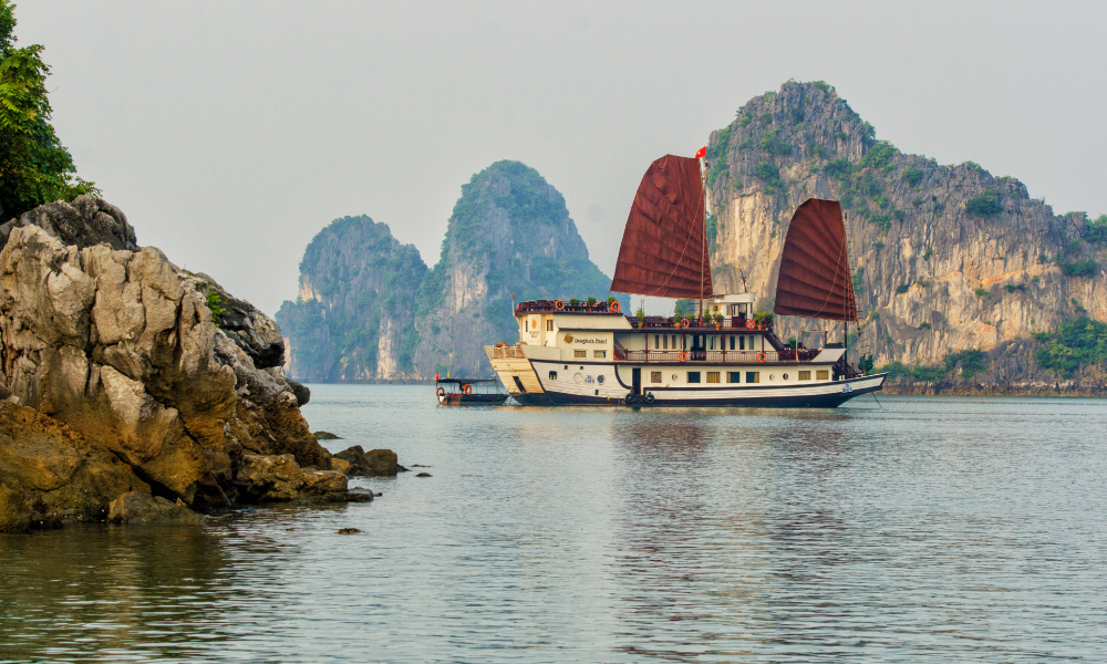 Dragon Pearl Junk sailing in Bai Tu Long Bay.