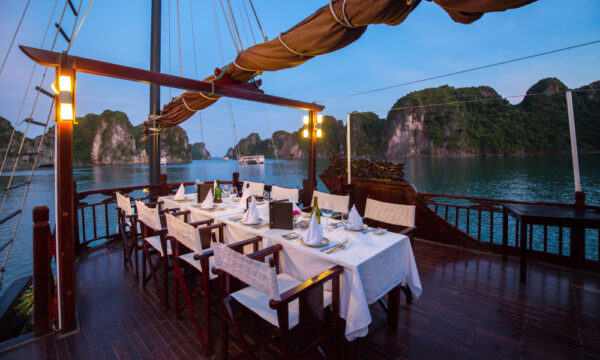 Outdoor dining table on Dragon Pearl Junk.