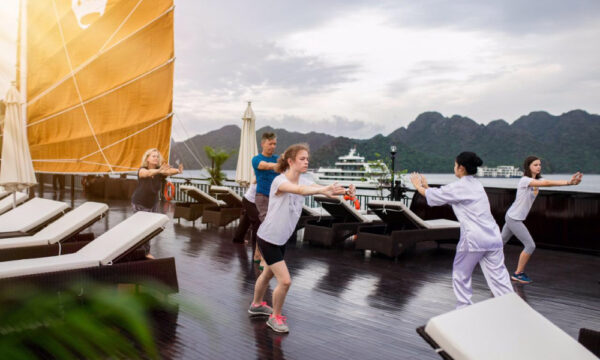 Morning Tai Chi Class on Genesis Regal Cruise sundeck in Lan Ha Bay.