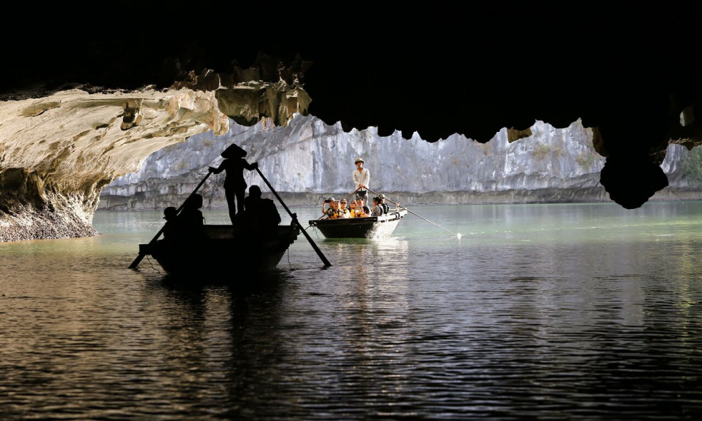 Kayaking through dark and light cave.